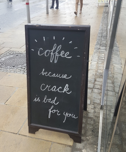Sidewalk sign reading, "Coffee, because crack is bad for you"
