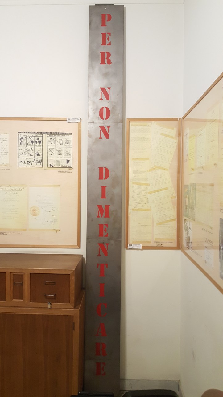 A sign stating "To Not Forget" in the WWII museum.